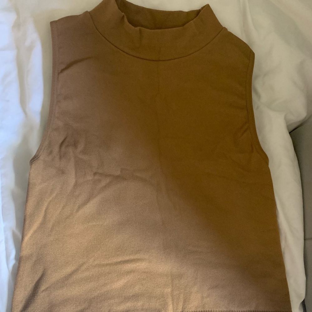 Stretchy high neck sleeveless shirt.